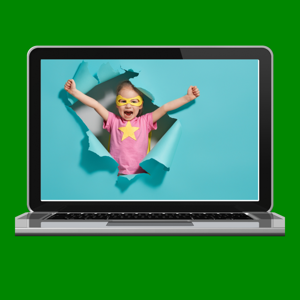 A laptop with an image of a superhero child bursting through a paper wall.